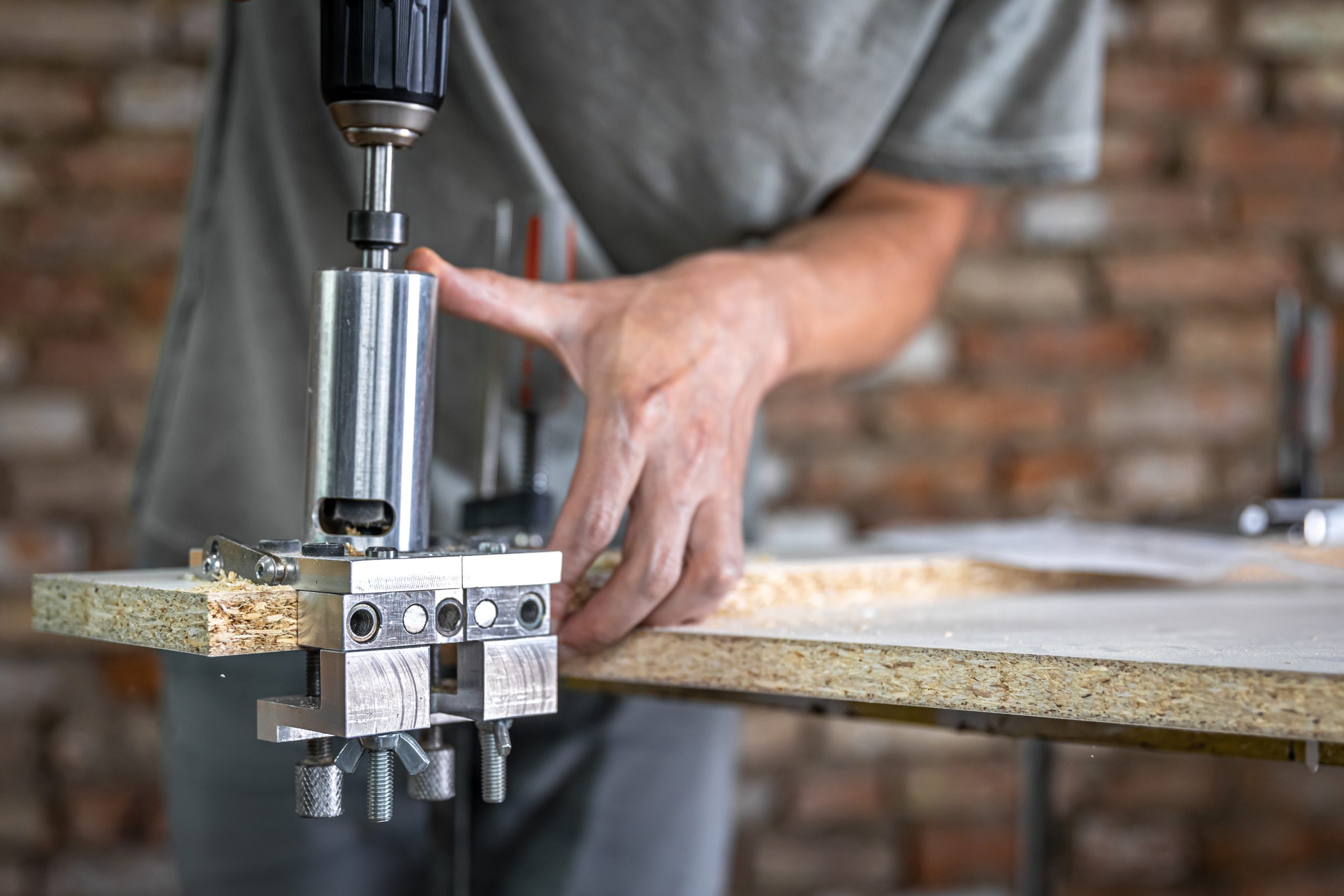 Pneumatic Tools the carpenter works as a professional tool for drilling wood.