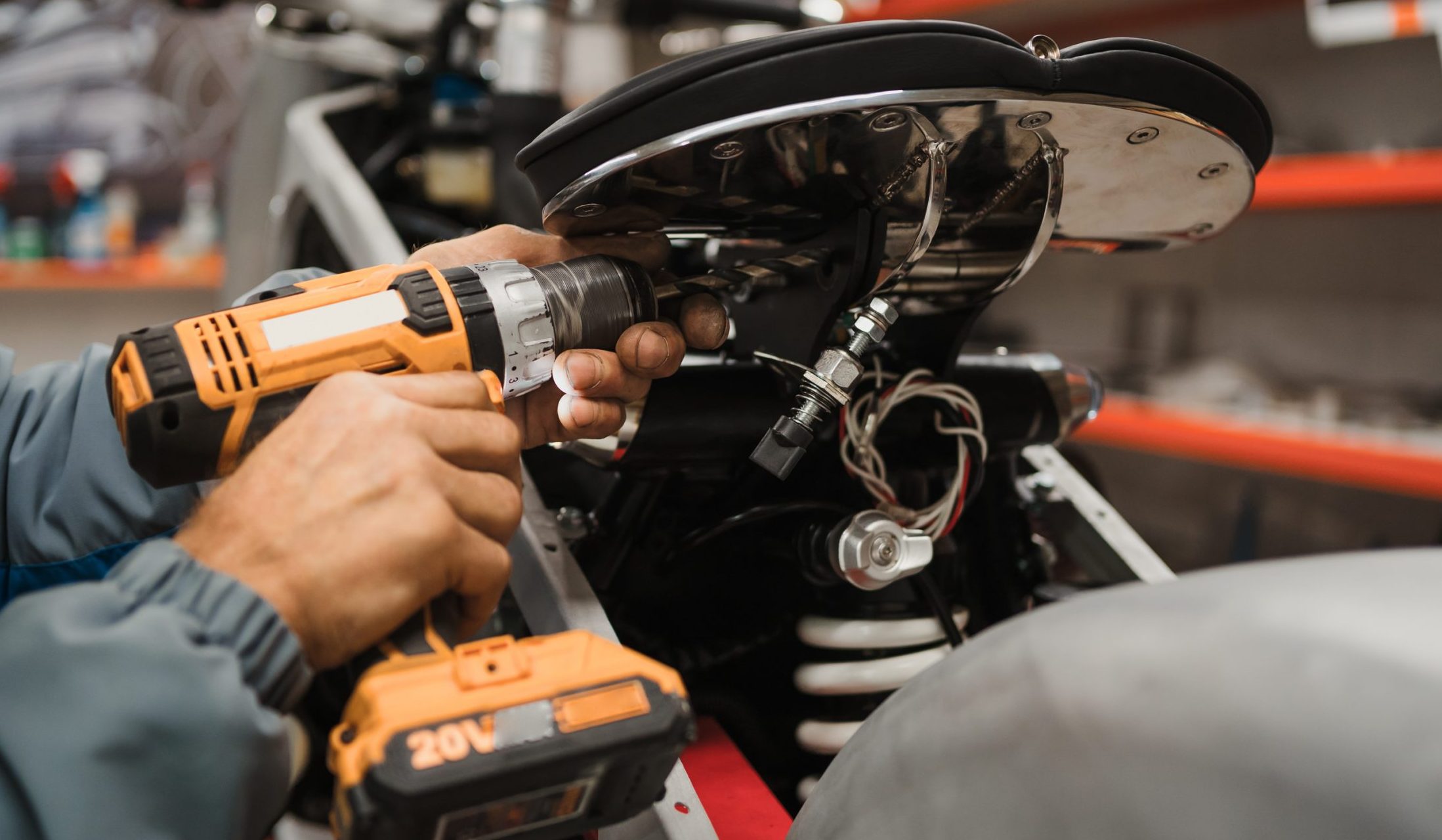 Pneumatic Tools man fixing a motorcycle in a modern workshop
