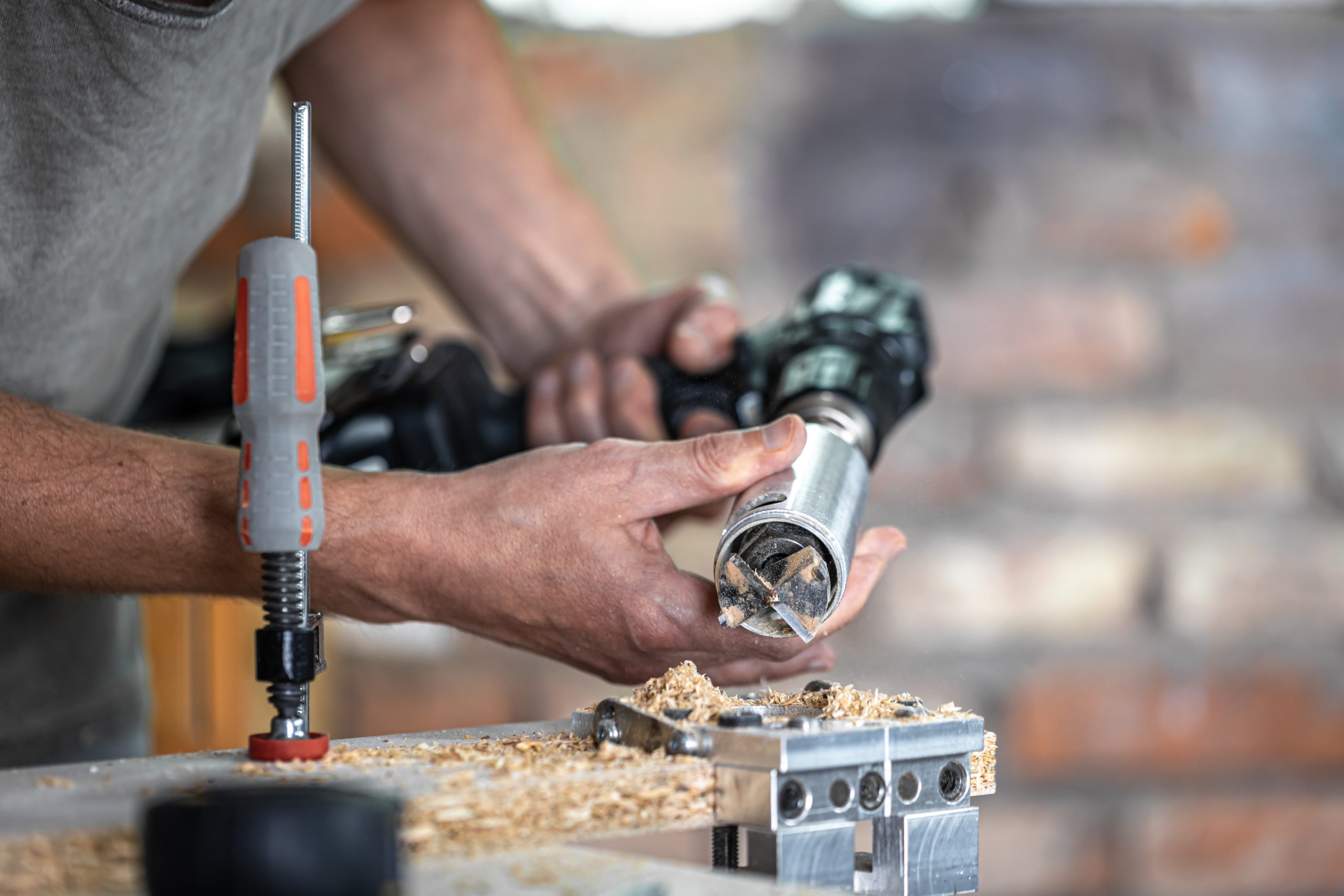 Power Tools close up a carpenter working with wood and building tools in house.